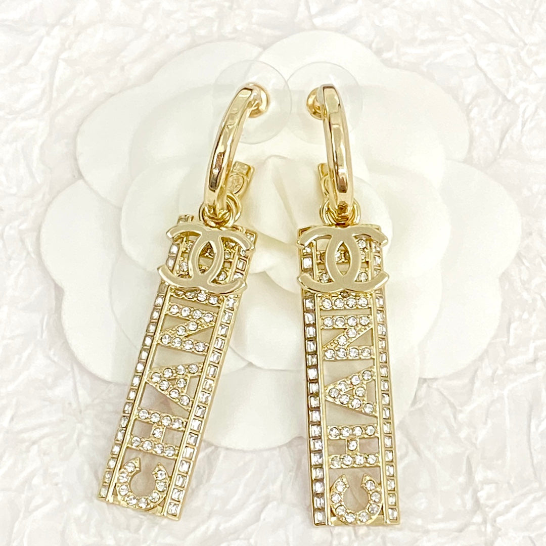 CC Text Diamond Paved Light Gold Drop Earrings