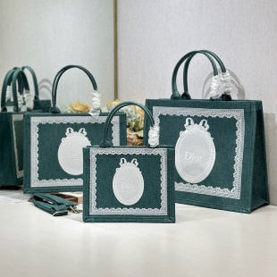CD Book Tote With Dark Teal Oblique Pattern And White Lace Details In Canvas 288328