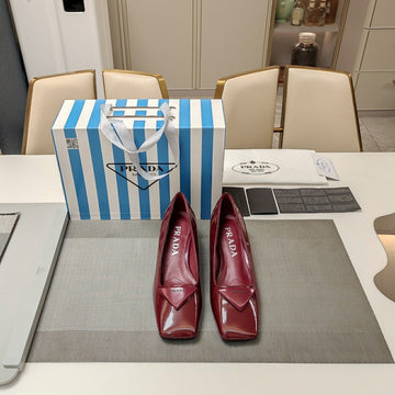 Triangle Logo Pumps In Currant Red Glossy Calfskin