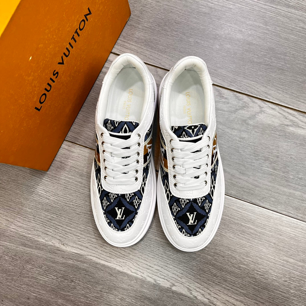 LV Trainer In White Embossed Calfskin And Monogram Fabric