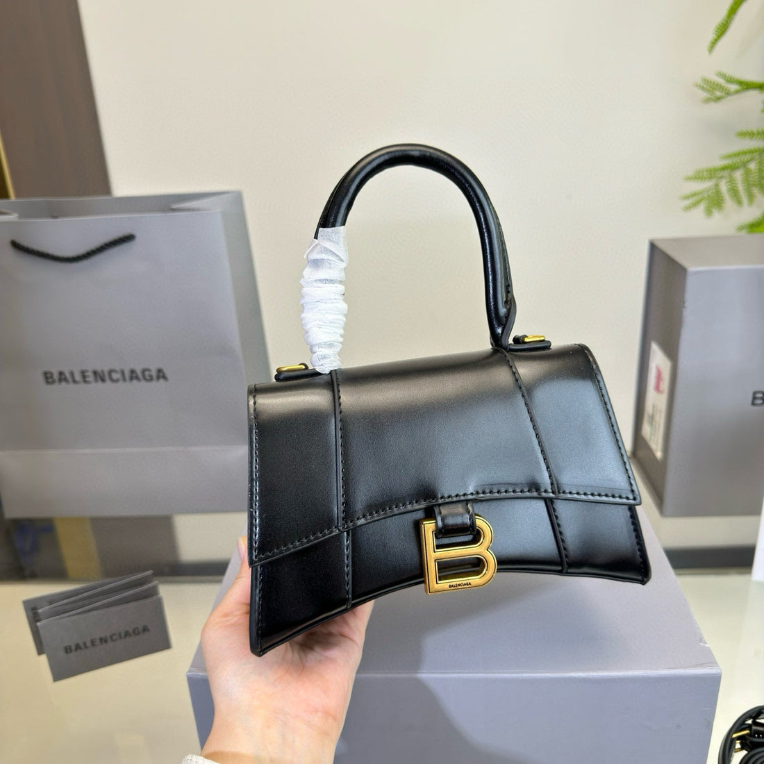 Hourglass Handbag 19 In Black Shiny Box Calfskin Gold Hardware