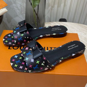 Bow Flat Mules In Black Monogram Lambskin