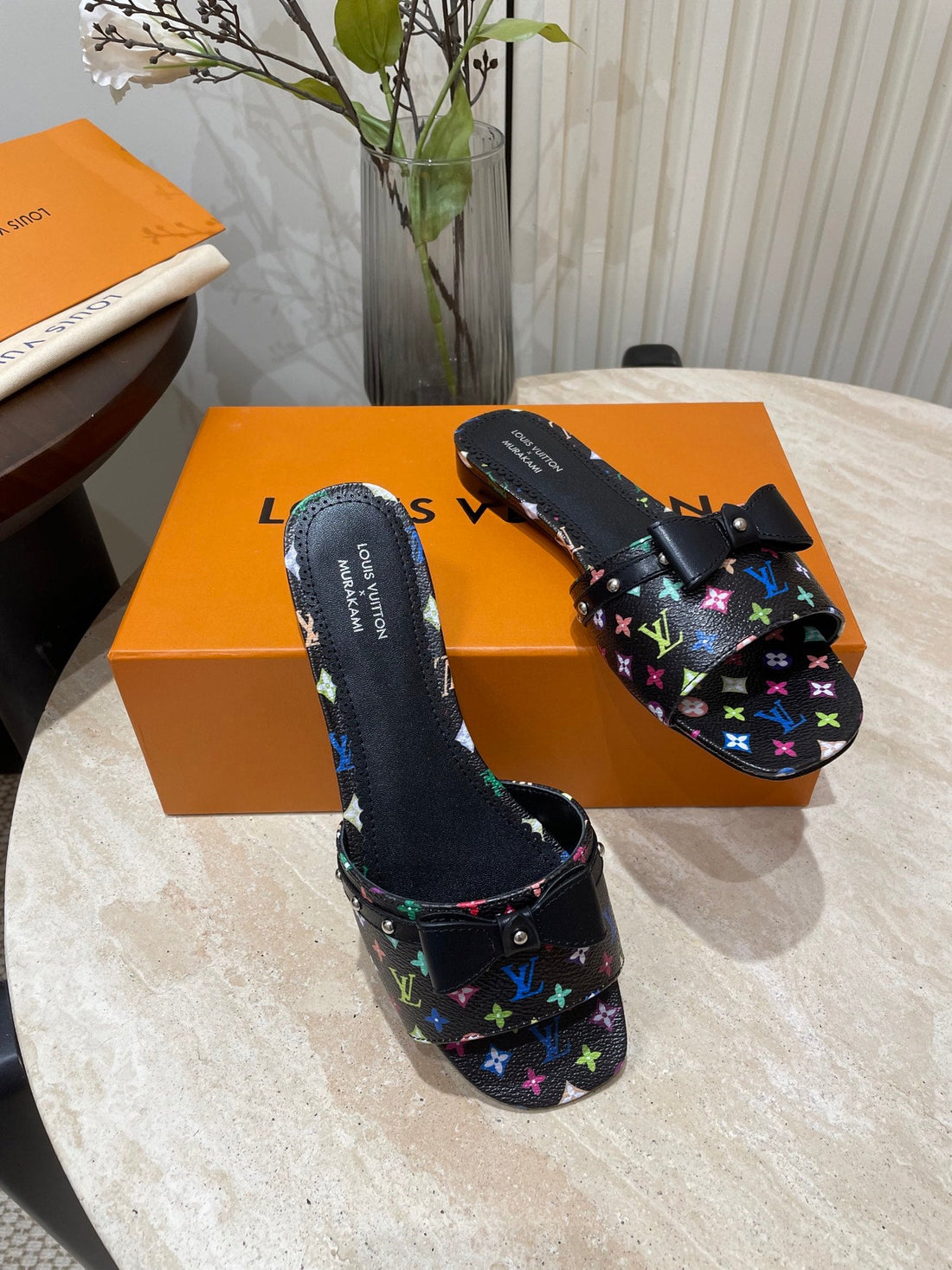 Bow Flat Mules In Black Monogram Lambskin