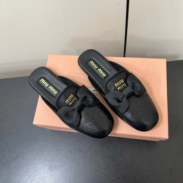 Bow Mules In Black Sheepskin