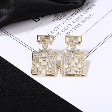 CC Perfume Bottle Gold Diamond Earrings