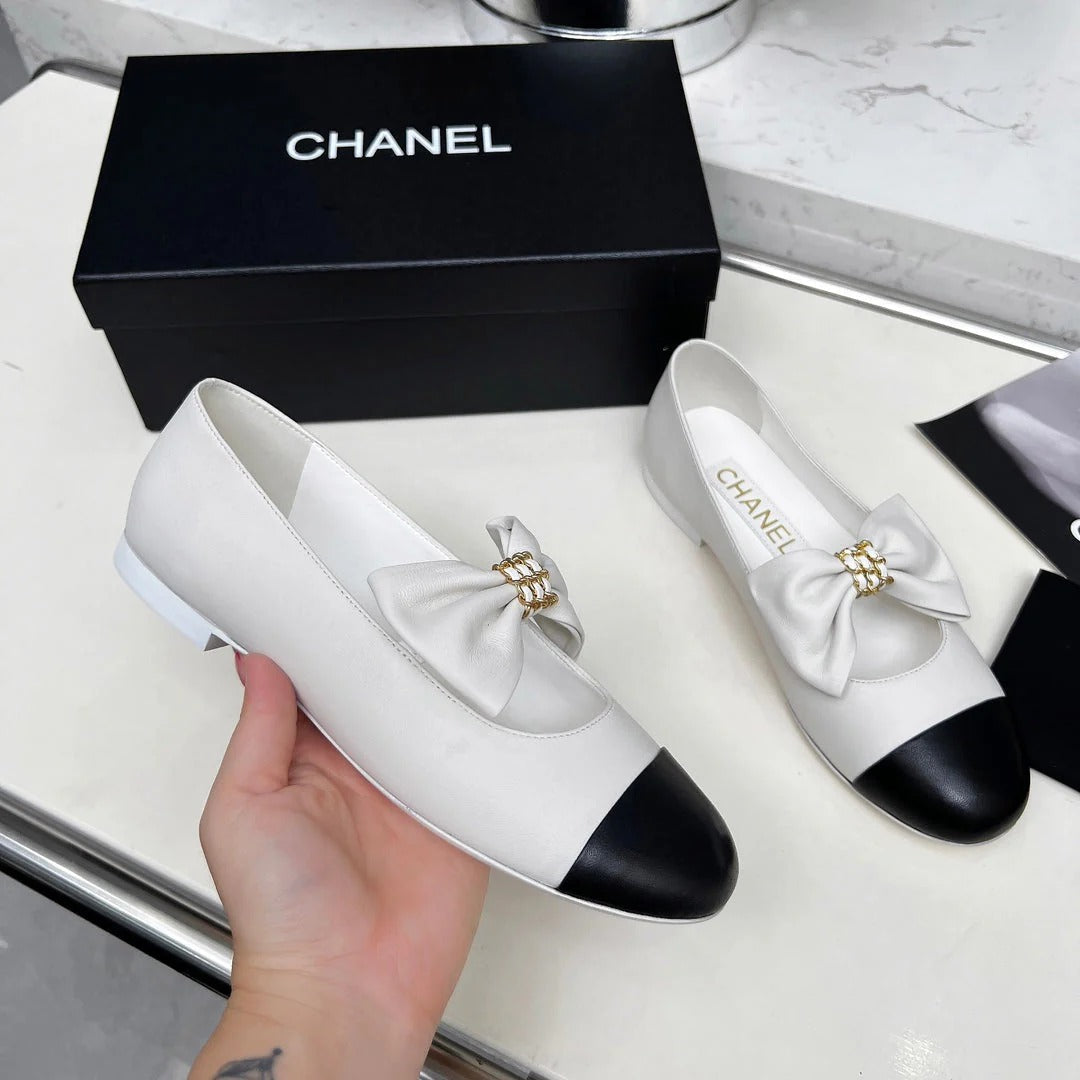 Chanel 25S Mary Janes In White Mix Black Calfskin With Bow Gold Hardwre